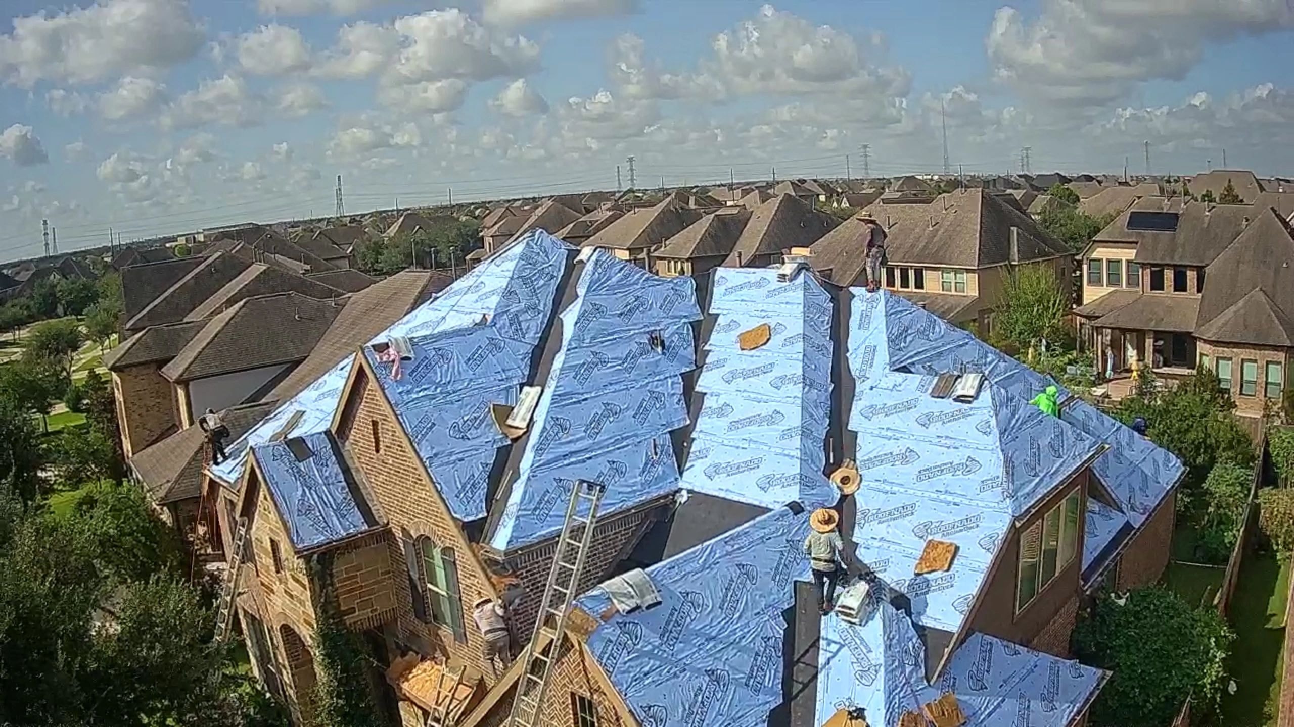 Residential roof with blue underlayment